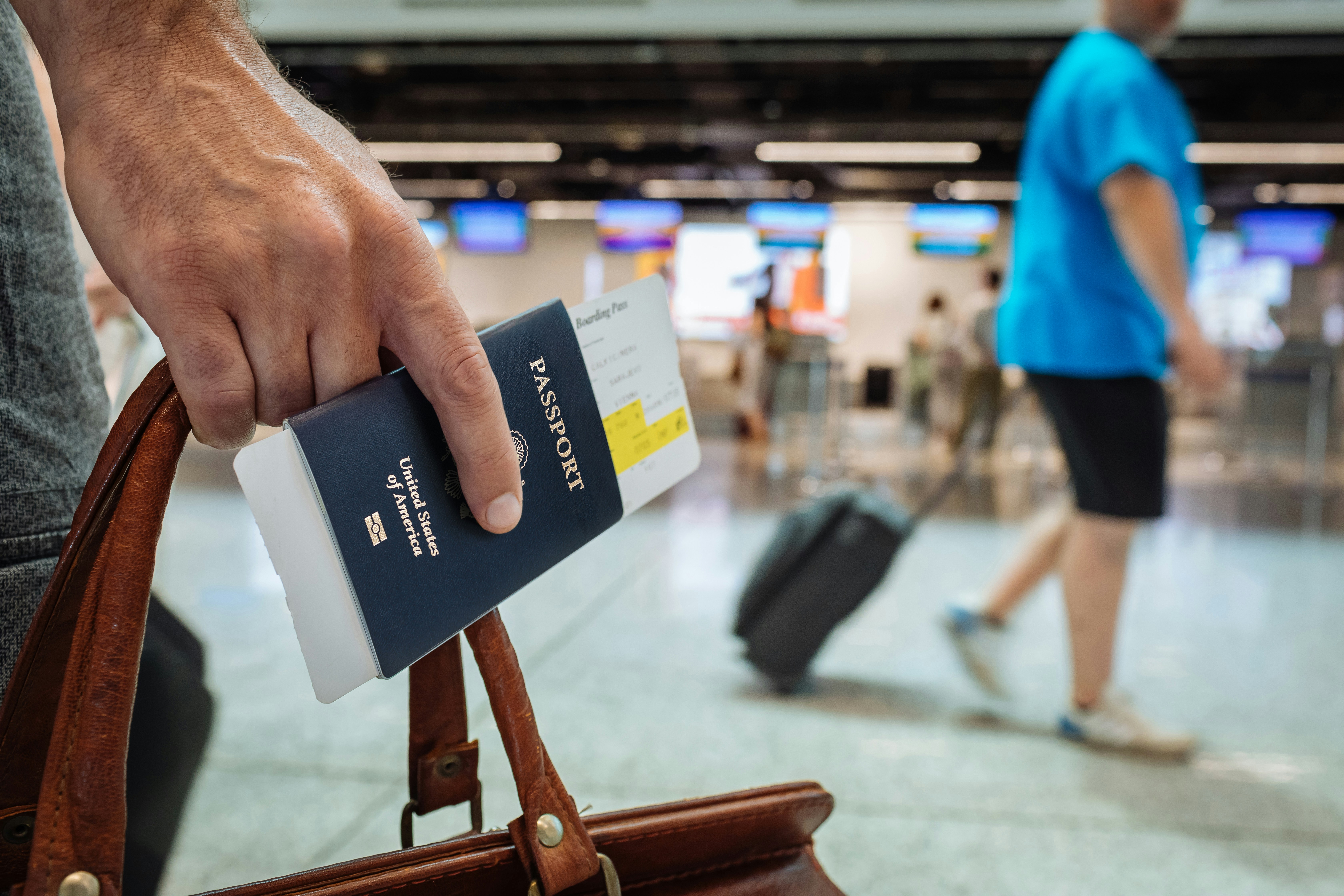 Customs and Border Protection officer checking documents at JFK airport for international tourists
