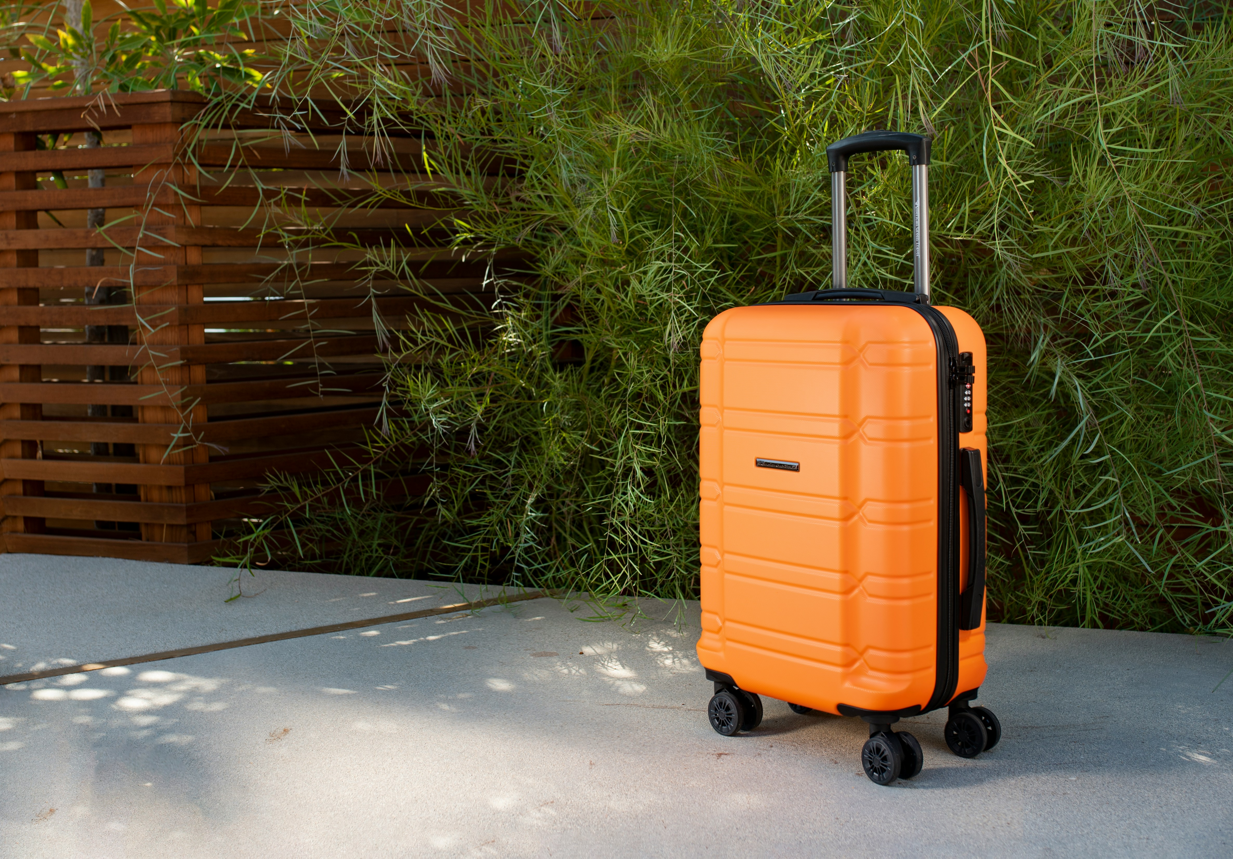 A carry-on bag packed with TSA-approved locks and portable power banks for a US domestic flight